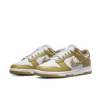Nike Dunk Low Essential Paisley Pack Barley (W) in gold and white, stylish sneaker for casual wear.
