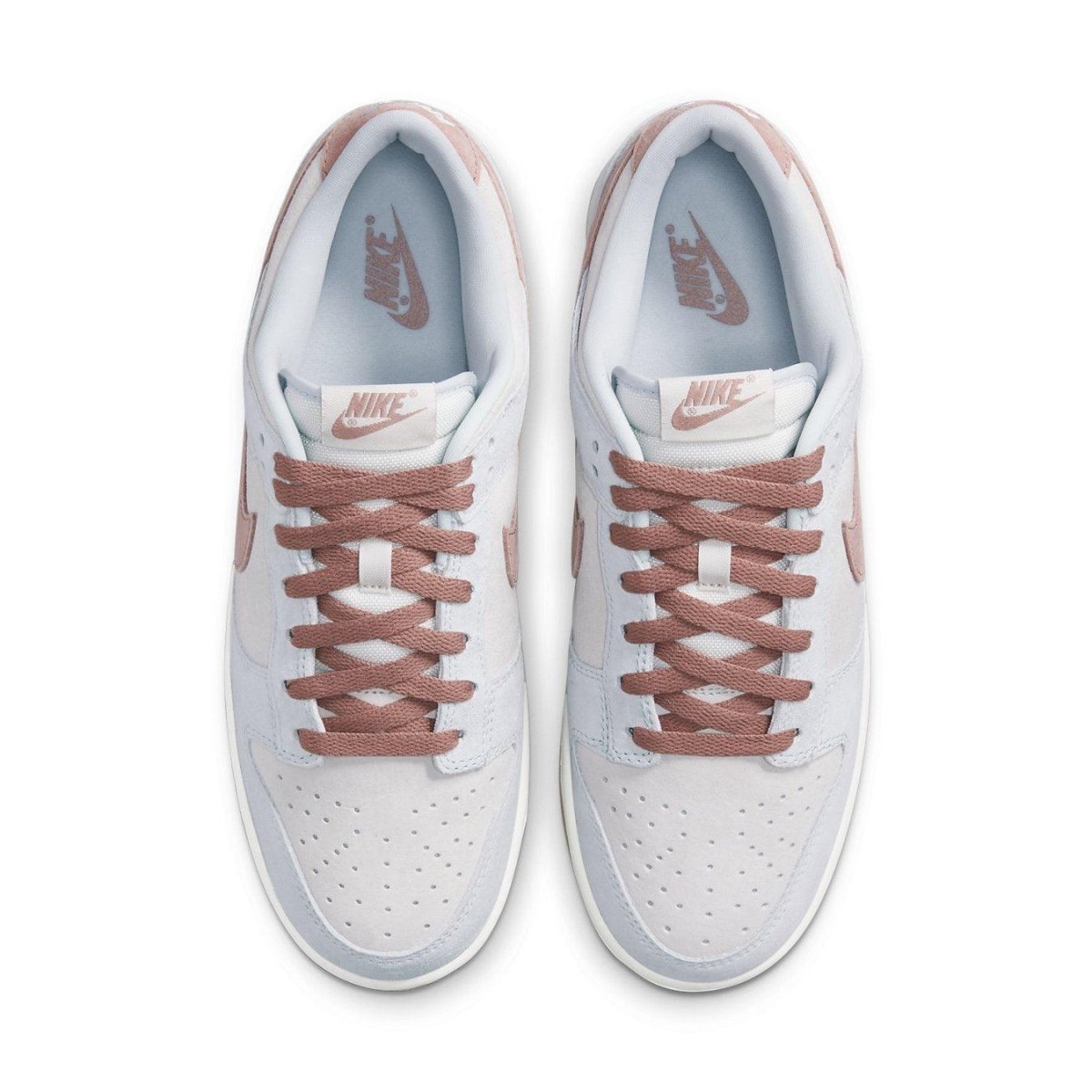Nike Dunk Low Fossil Rose sneakers in beige and pastel pink with suede details and white accents.
