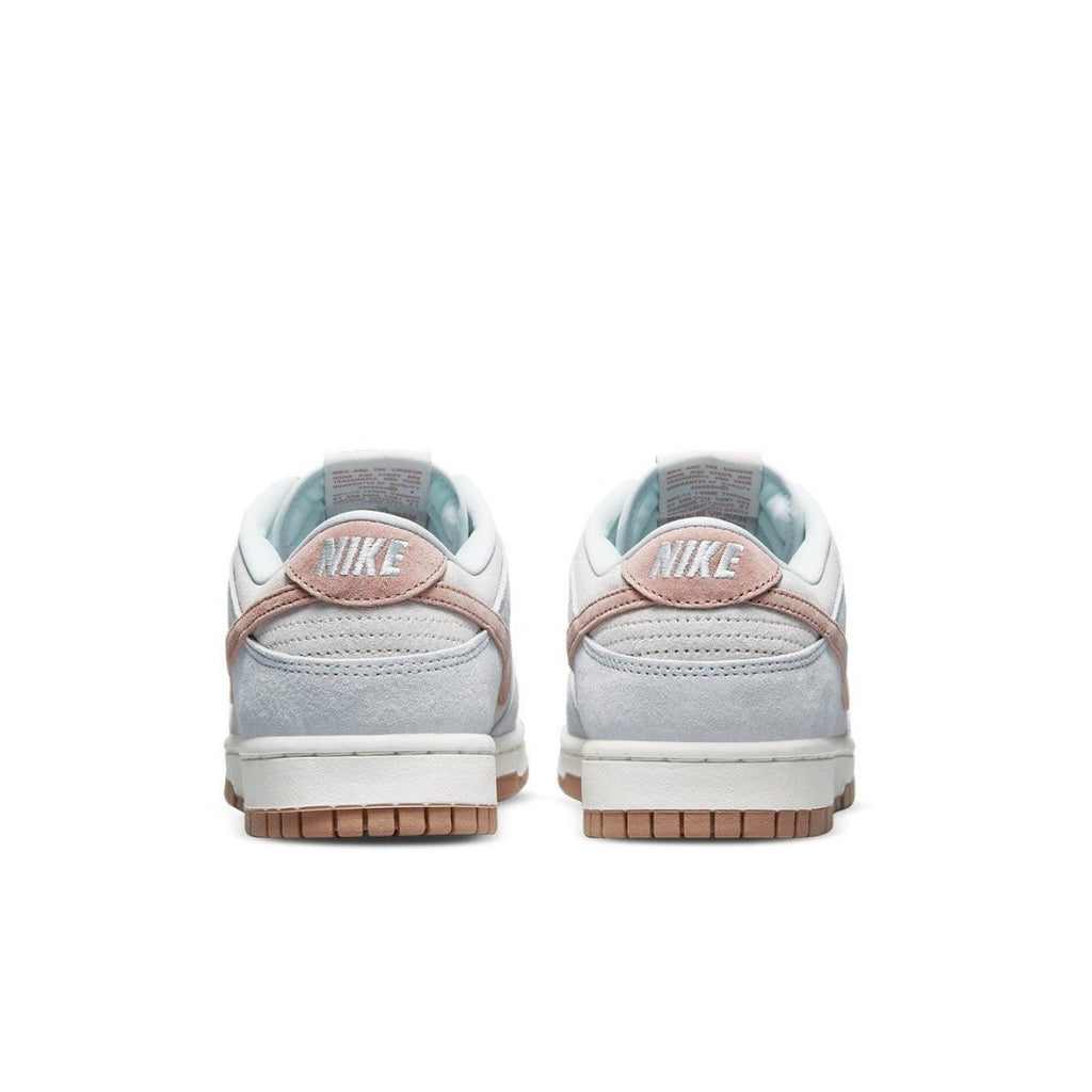 Nike Dunk Low Fossil Rose sneakers rear view featuring beige suede and pastel pink accents.