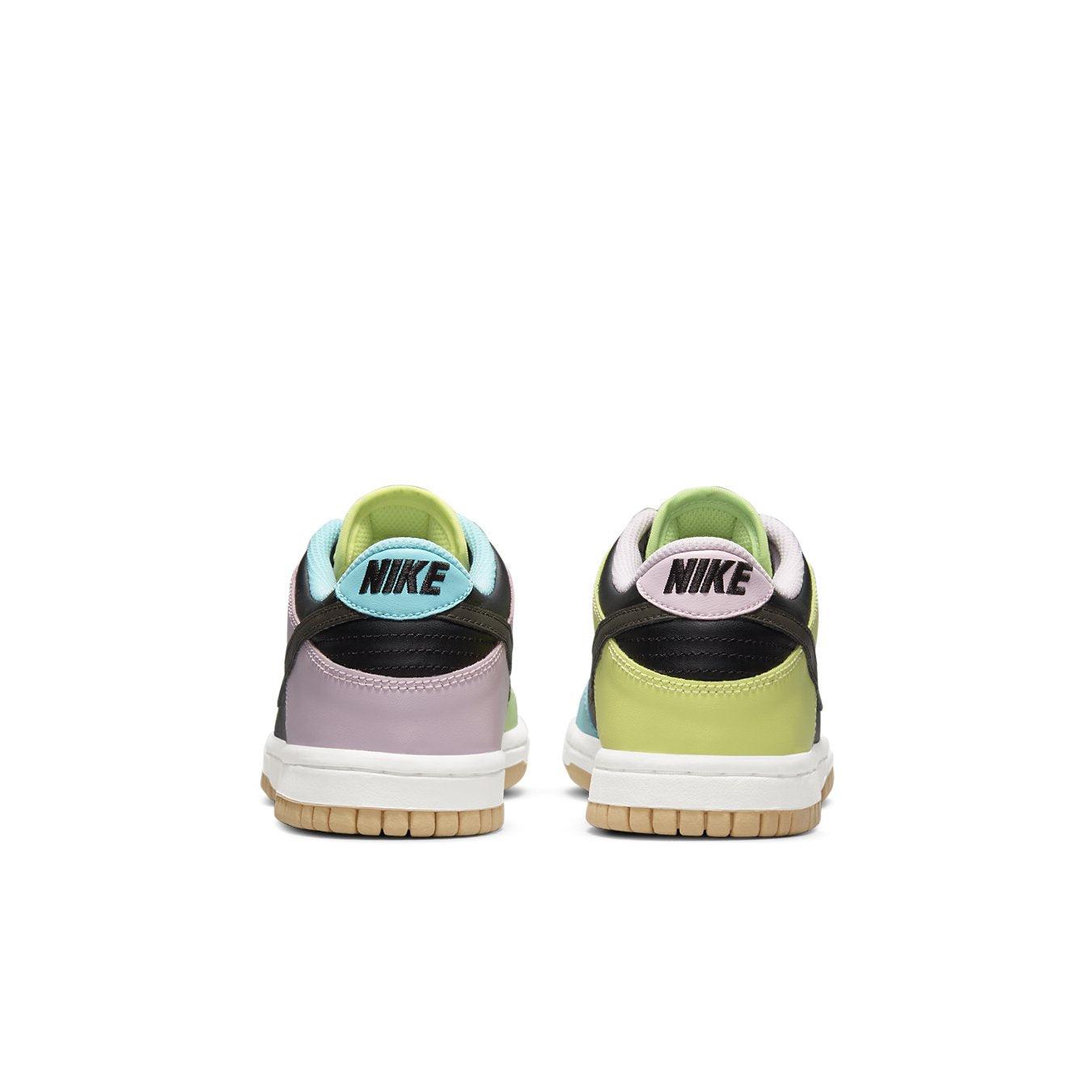 Back view of Nike Dunk Low SE GS 'Free.99 - Black' featuring unique color blocking and logo detail.