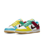 Nike Dunk Low Free 99 White sneaker featuring colorful accents in red, green, yellow, and blue on a white leather base.