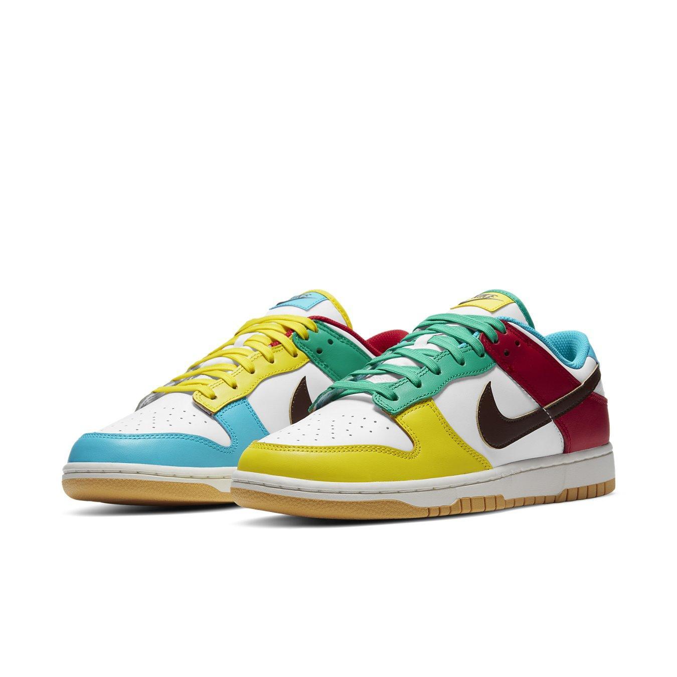 Nike Dunk Low Free 99 White sneaker featuring colorful accents in red, green, yellow, and blue on a white leather base.