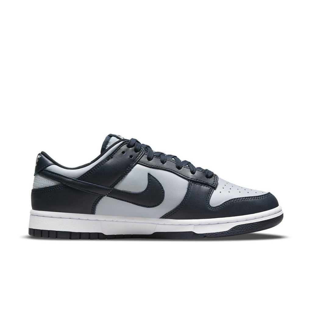 Nike Dunk Low Georgetown sneakers in gray and navy blue colorway with classic design and leather upper.