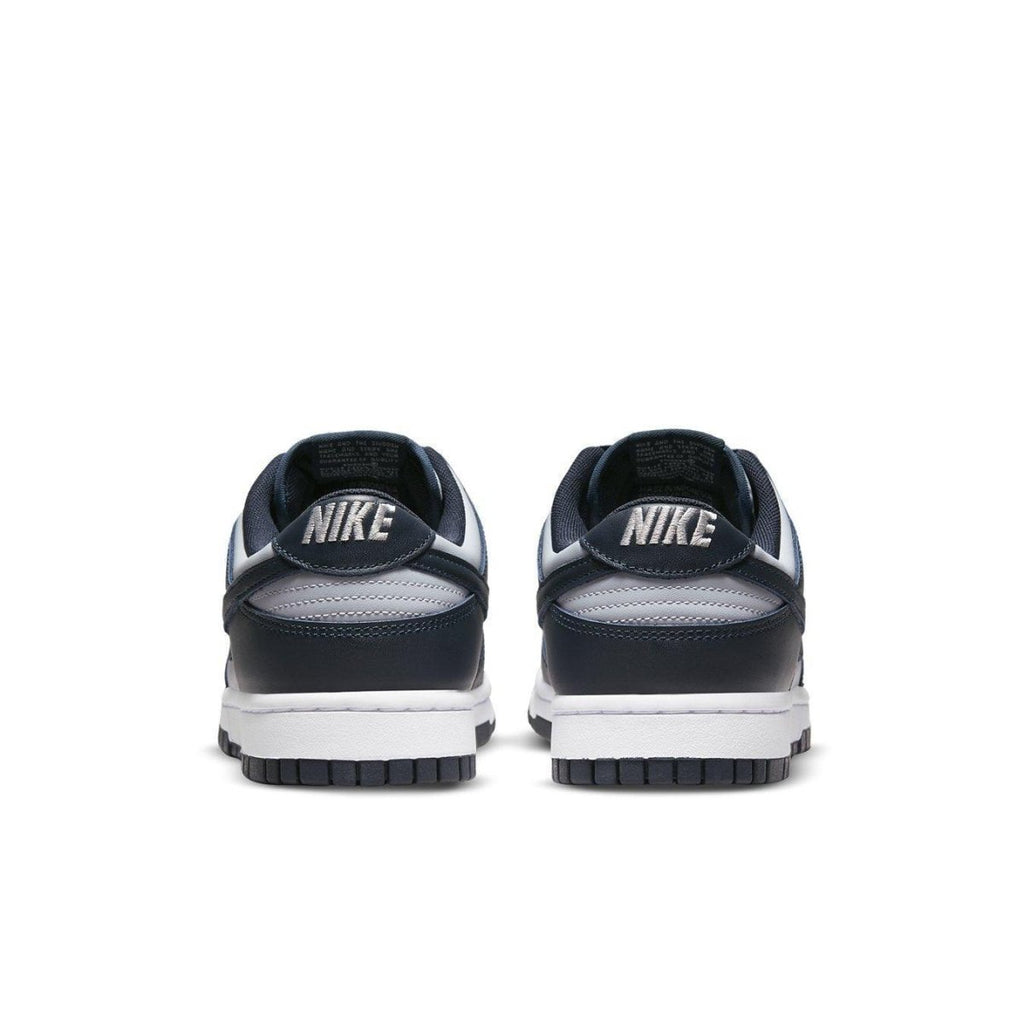Rear view of Nike Dunk Low Georgetown sneakers featuring navy blue and grey color scheme with Nike branding.