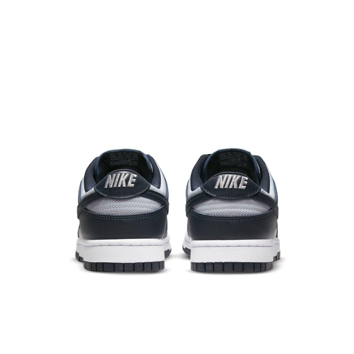 Rear view of Nike Dunk Low Georgetown sneakers featuring navy blue and grey color scheme with Nike branding.