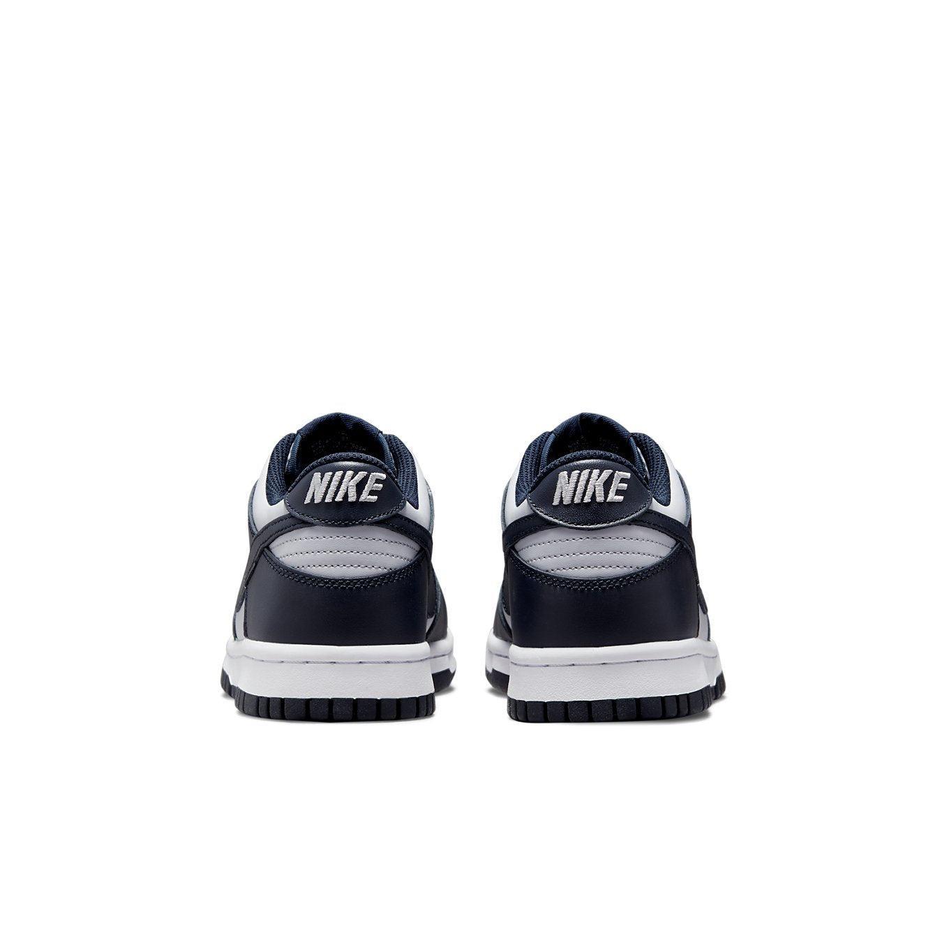 Rear view of Nike Dunk Low Georgetown GS sneakers featuring dark obsidian and light gray leather.
