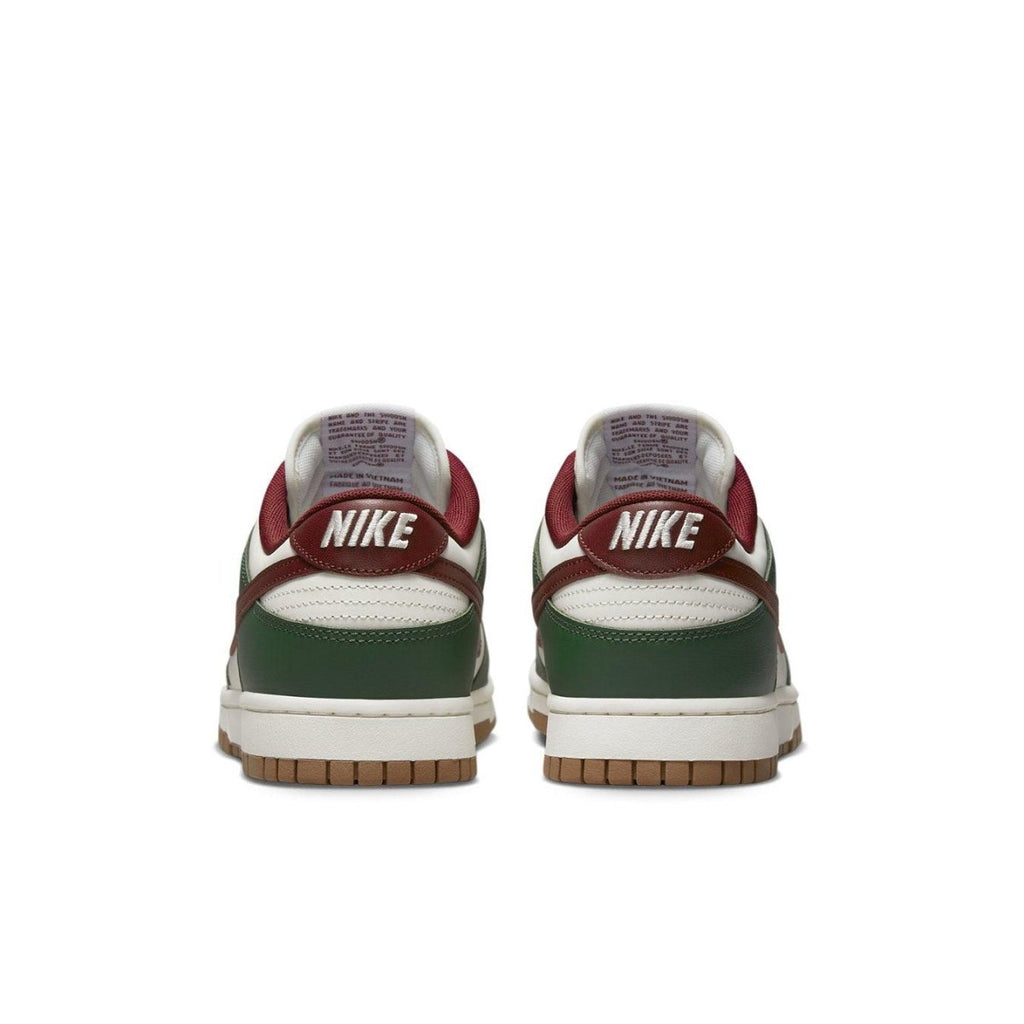 Nike Dunk Low Gorge Green sneakers rear view with green and red accents, showcasing vintage basketball style.