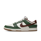 Nike Dunk Low Gorge Green sneaker with white and red accents, featuring leather upper and padded sole for comfort.