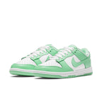 Nike Dunk Low Green Glow (W) in white and aqua green, showcasing sleek leather design and classic color blocking.