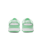 Nike Dunk Low Green Glow women's sneakers featuring a pastel green and white design from the back view.