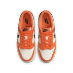Nike Dunk Low Halloween 2022 sneakers in orange and white, showcasing top view with Nike branding.