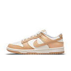 Nike Dunk Low Harvest Moon women's sneaker in white and light brown with perforations and gum sole.