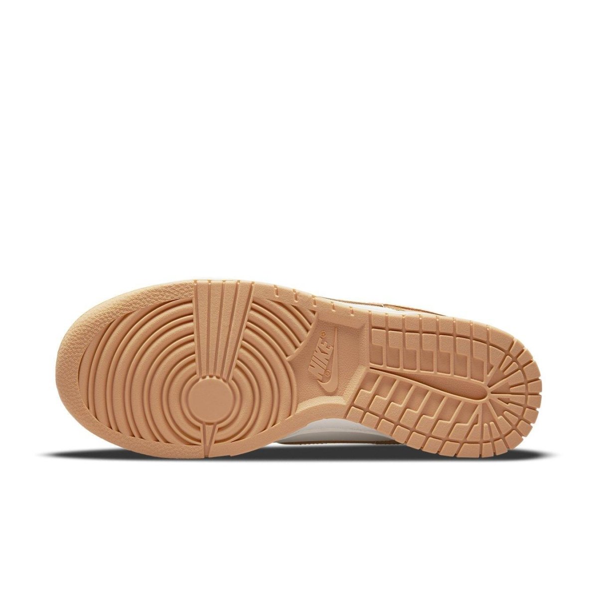 Sole view of Nike Dunk Low Harvest Moon sneaker featuring gum rubber outsole and textured patterns.