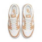 Nike Dunk Low Harvest Moon (W) with white leather base and light brown overlays, featuring perforated toe and logo details.