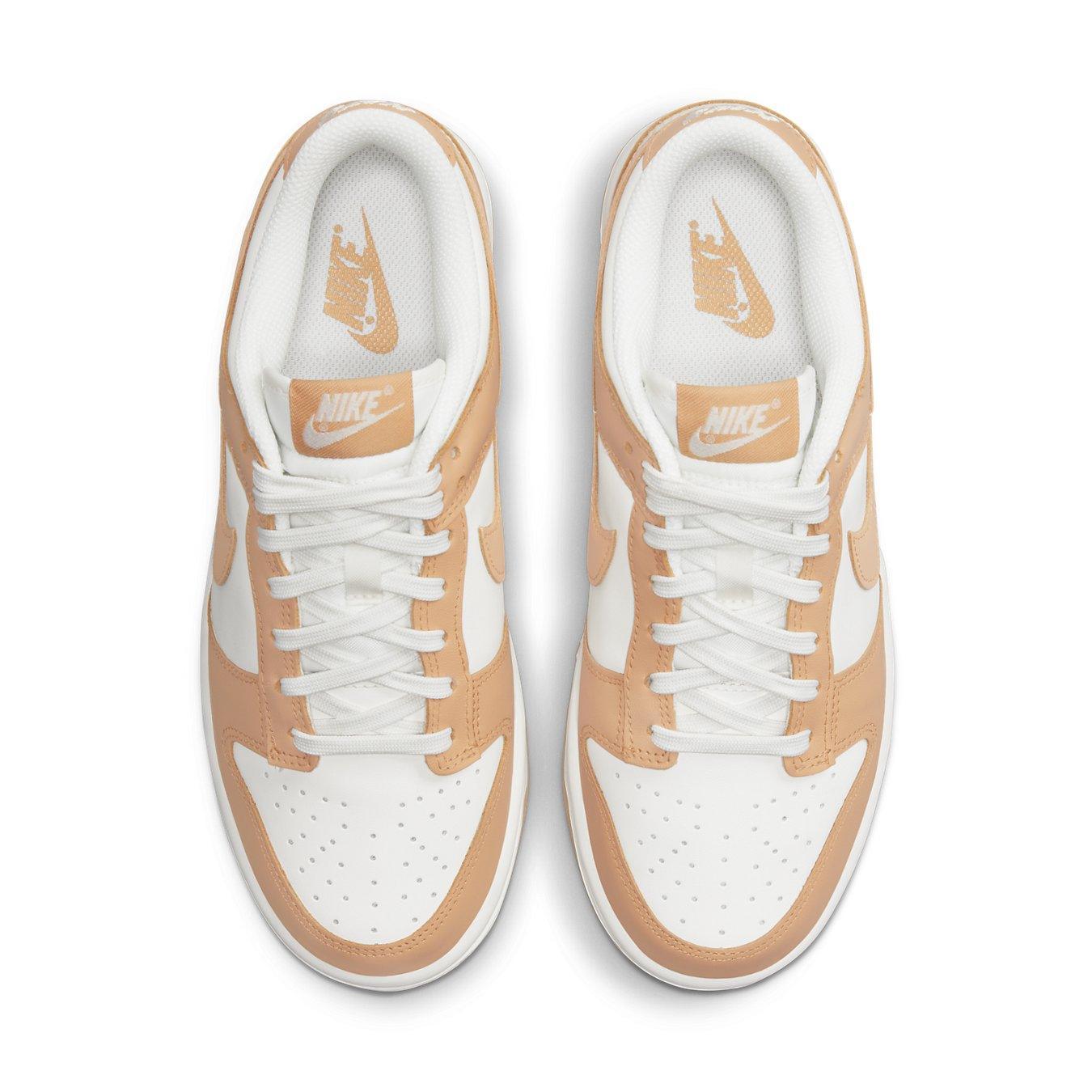 Nike Dunk Low Harvest Moon (W) with white leather base and light brown overlays, featuring perforated toe and logo details.