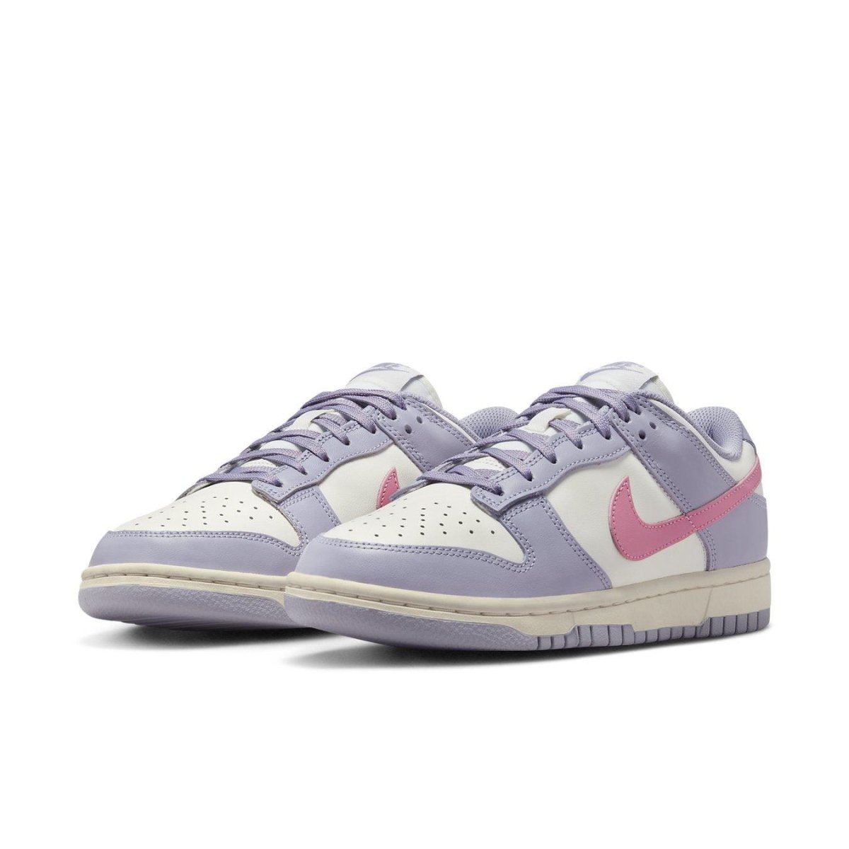 Nike Dunk Low Indigo Haze women's sneakers in pastel purple and cream with pink Swoosh.