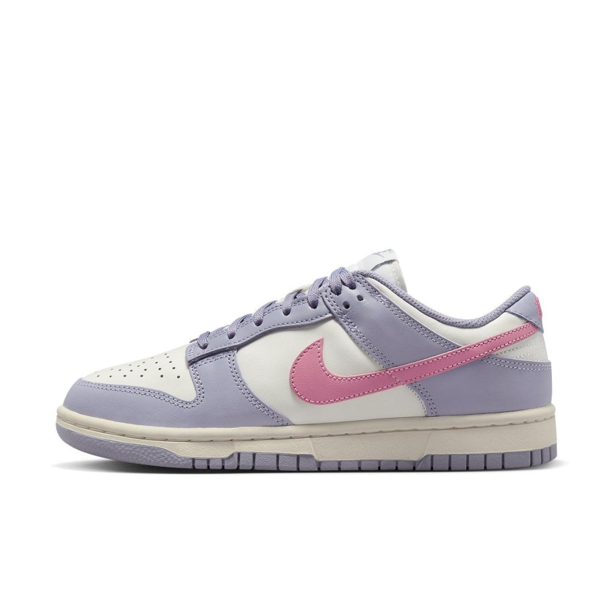 Nike Dunk Low Indigo Haze women's sneaker in pastel indigo with cream panels and pink Swoosh.