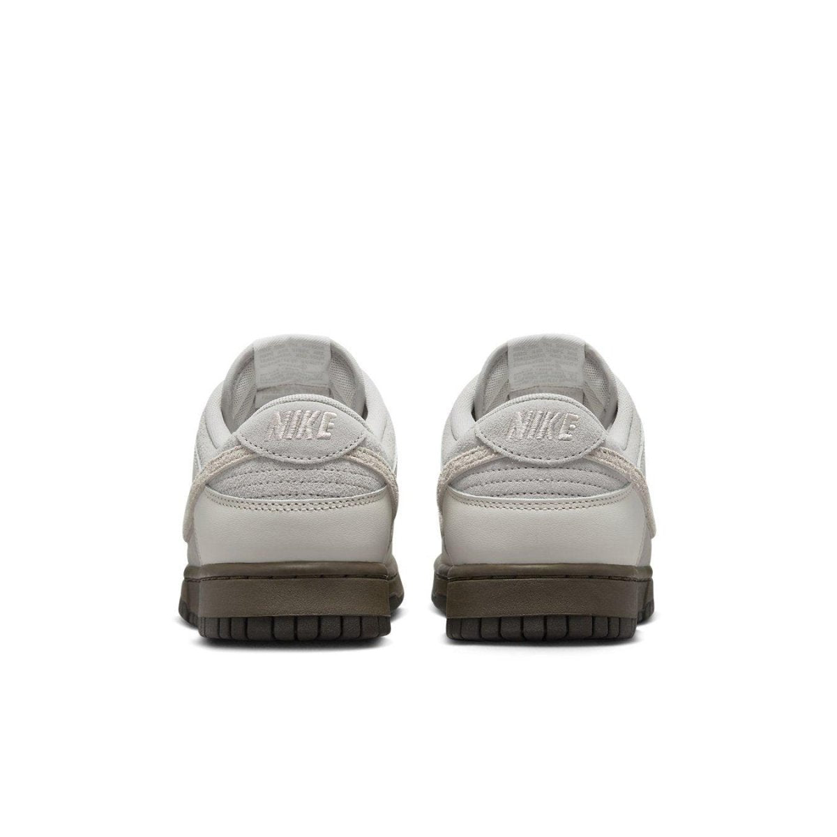 Nike Dunk Low Ironstone sneaker rear view with light grey upper and chocolate sole.