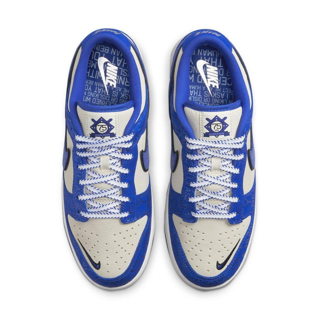 Nike Dunk Low Jackie Robinson sneakers with blue and cream color scheme, celebrating 75 years of breaking baseball's color barrier.