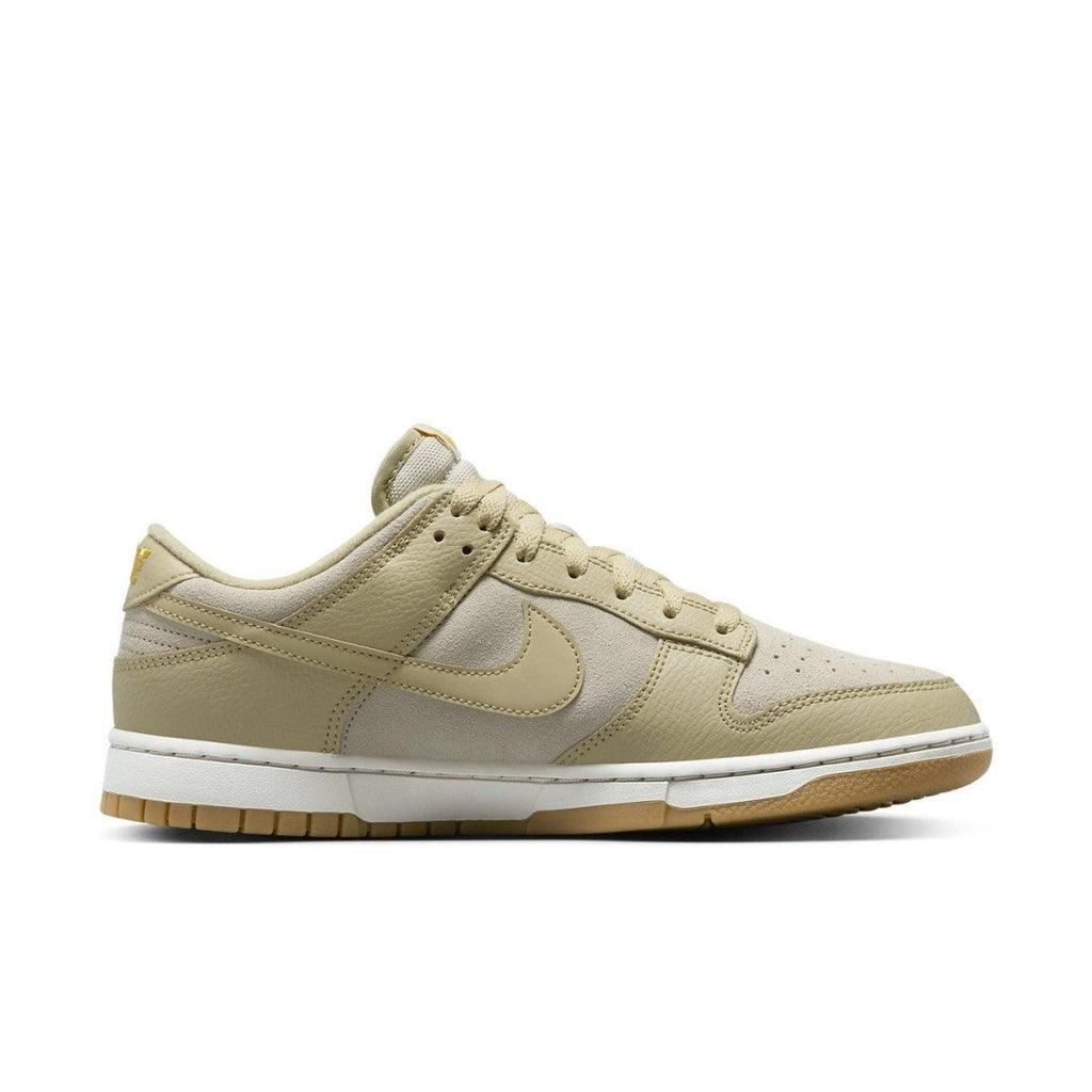 Nike Dunk Low Khaki Suede Gum sneakers featuring premium materials and classic Swoosh design.