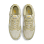 Nike Dunk Low Khaki Suede Gum sneakers with perforated toe and signature Swoosh design, top view.