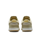 Nike Dunk Low Khaki Suede Gum sneaker rear view with yellow logo and gum sole.