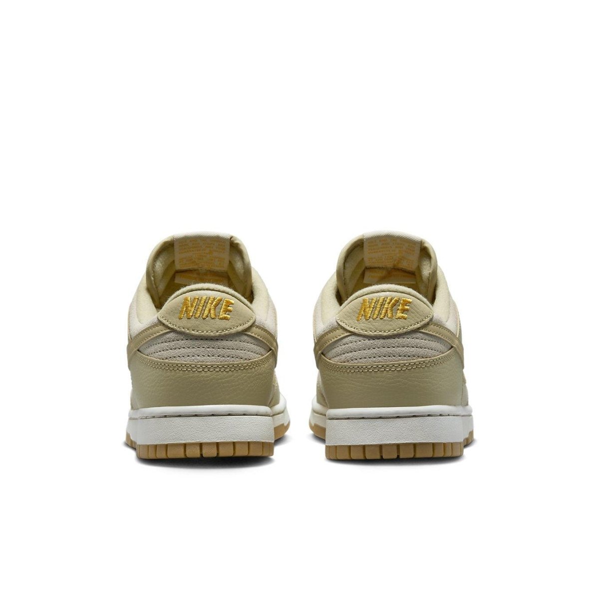 Nike Dunk Low Khaki Suede Gum sneaker rear view with yellow logo and gum sole.