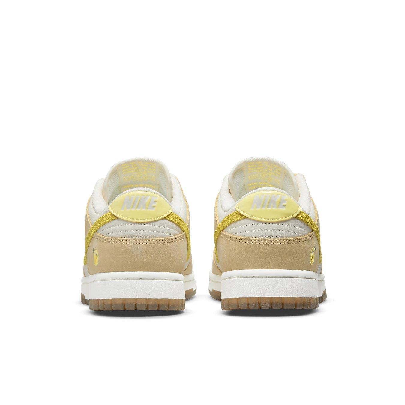 Nike Dunk Low Lemon Drop sneakers rear view showcasing yellow details and lemon embroidery on the heel.