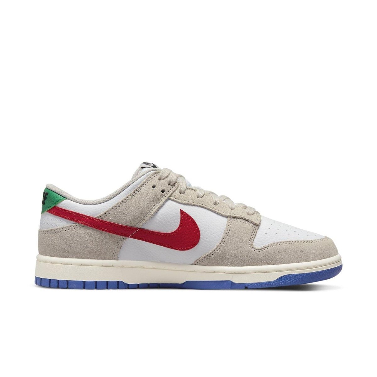 Nike Dunk Low in Light Iron Ore with red and green accents on a white and grey suede upper.