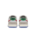 Rear view of Nike Dunk Low Light Iron Ore with red accents and green logo on heel.