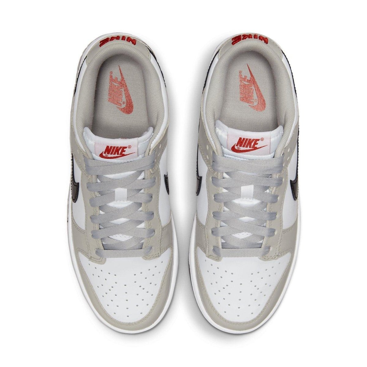 Nike Dunk Low Light Iron Ore sneakers top view with grey and white design and black Swoosh.