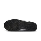 Nike Dunk Low Light Iron Ore (W) shoe sole view showcasing its unique tread design and branding details.
