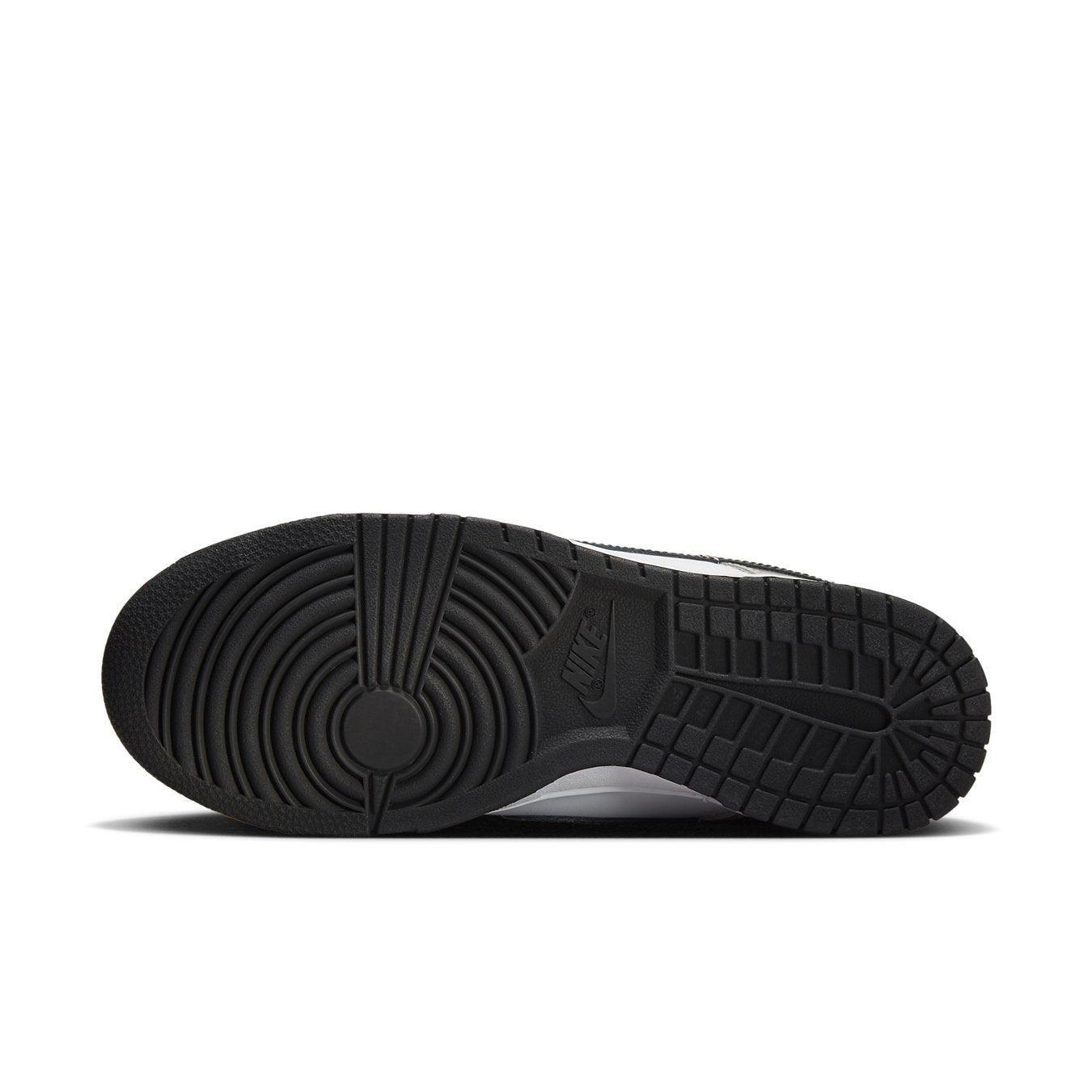 Nike Dunk Low Light Iron Ore (W) shoe sole view showcasing its unique tread design and branding details.
