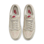 Nike Dunk Low Light Orewood Brown Sashiko sneaker with red accents and star detailing on a light background.