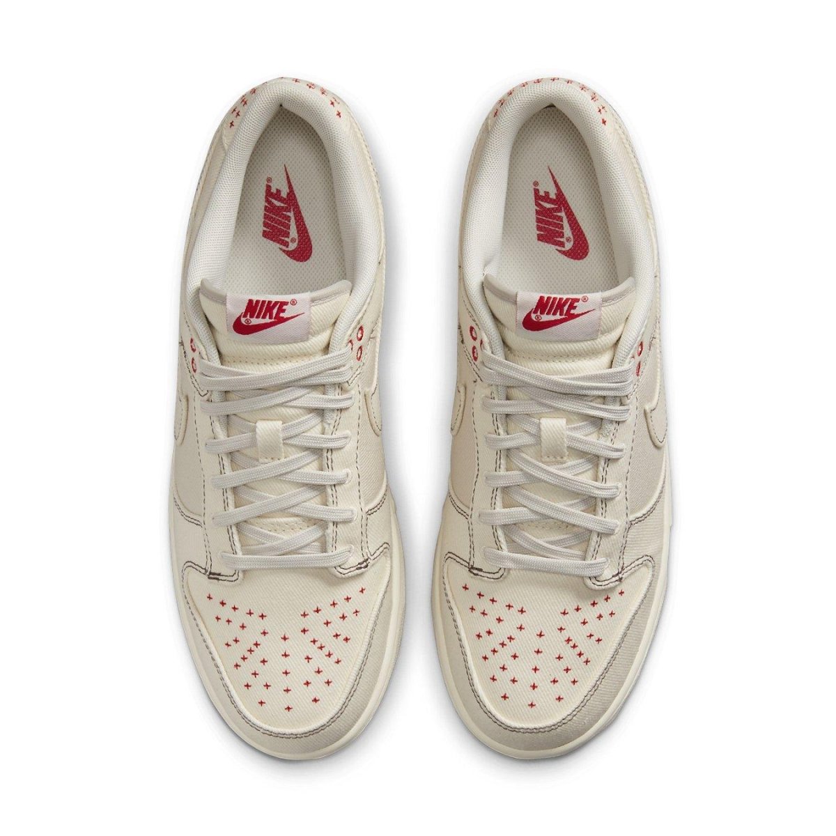 Nike Dunk Low Light Orewood Brown Sashiko sneaker with red accents and star detailing on a light background.
