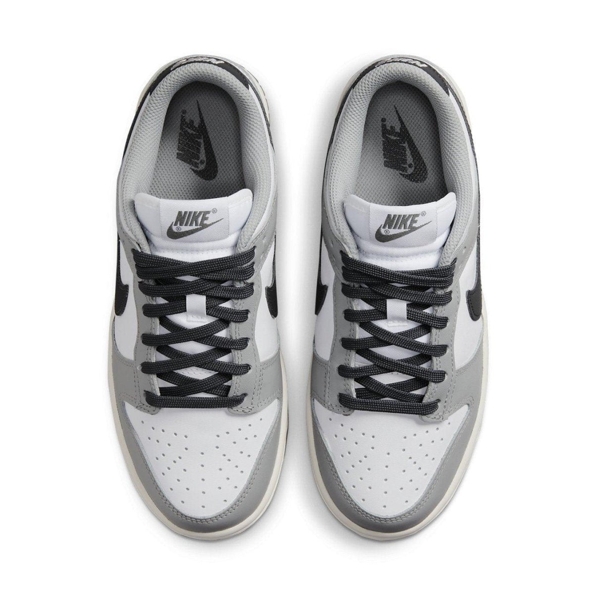 Nike Dunk Low Light Smoke Grey women's sneakers with white leather and black accents, top view.