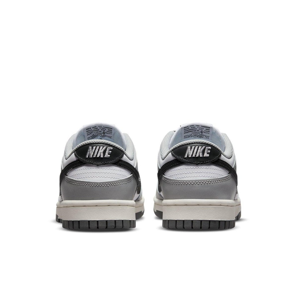 Nike Dunk Low Light Smoke Grey women's sneaker heel view with black and grey detailing.