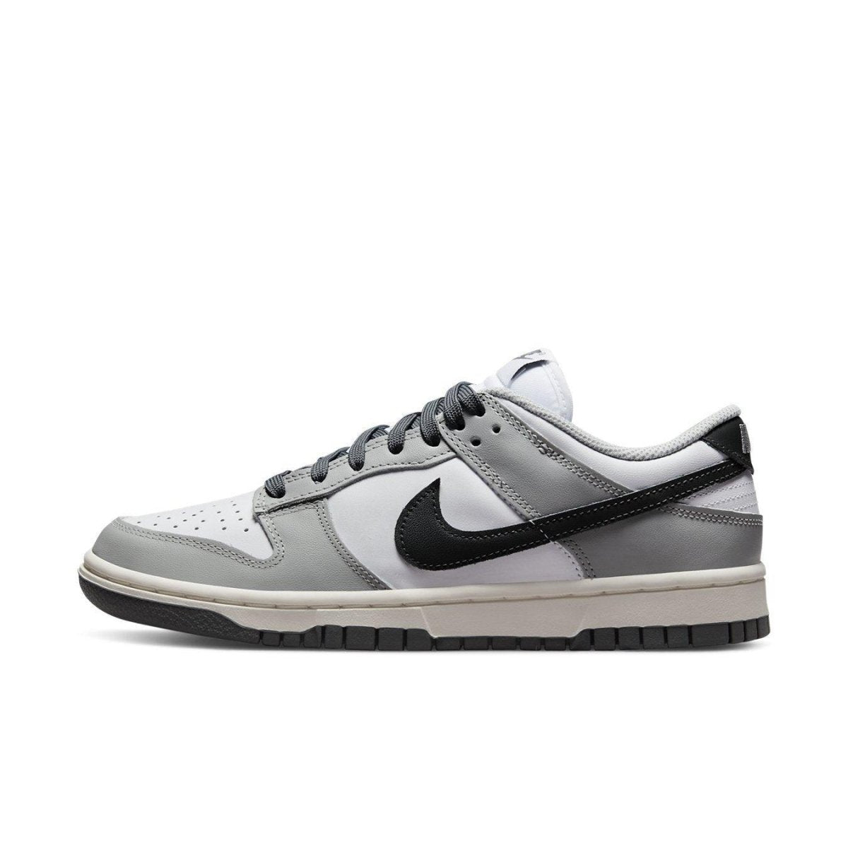 Nike Dunk Low Light Smoke Grey women’s sneaker featuring white leather base and contrasting black Swoosh.