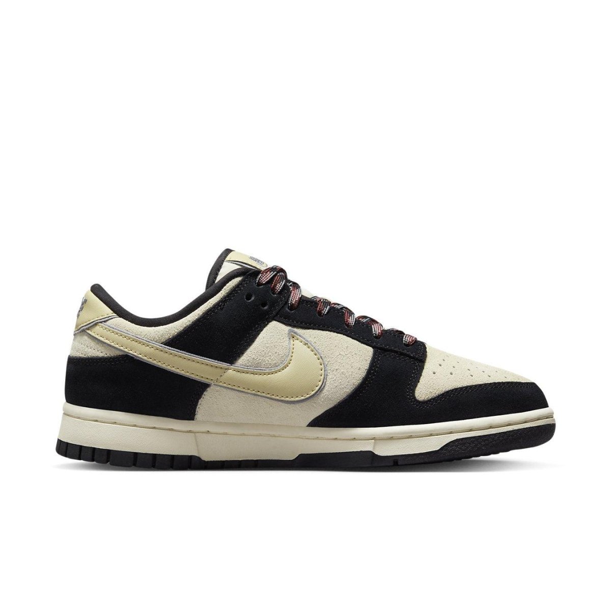 Nike Dunk Low LX Black Team Gold (W) featuring sesame seed overlay design and contrasting blue Swoosh.