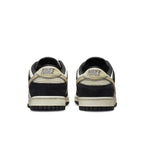 Rear view of Nike Dunk Low LX Black Team Gold sneakers with contrasting details and padded collar, showcasing stylish design.