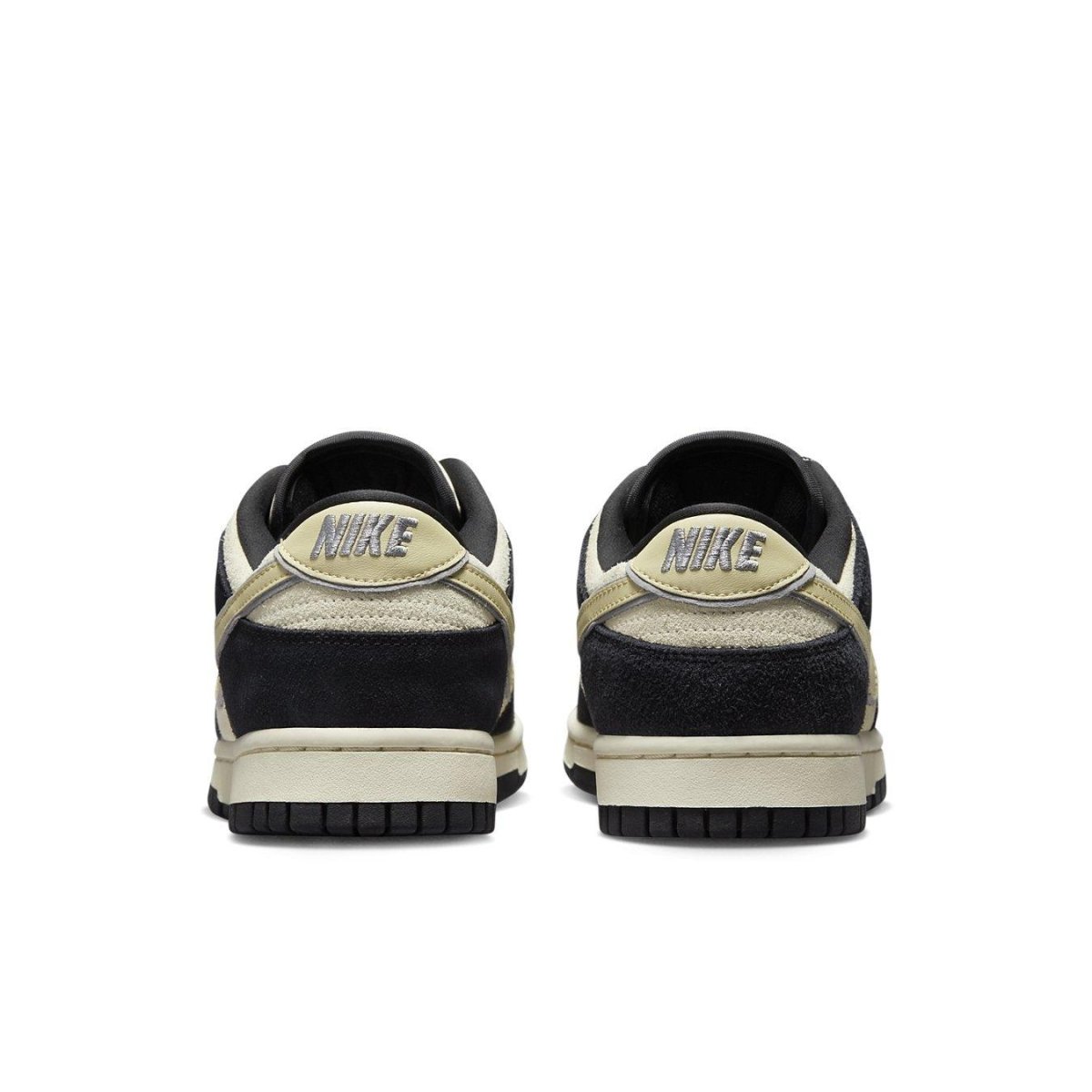 Rear view of Nike Dunk Low LX Black Team Gold sneakers with contrasting details and padded collar, showcasing stylish design.