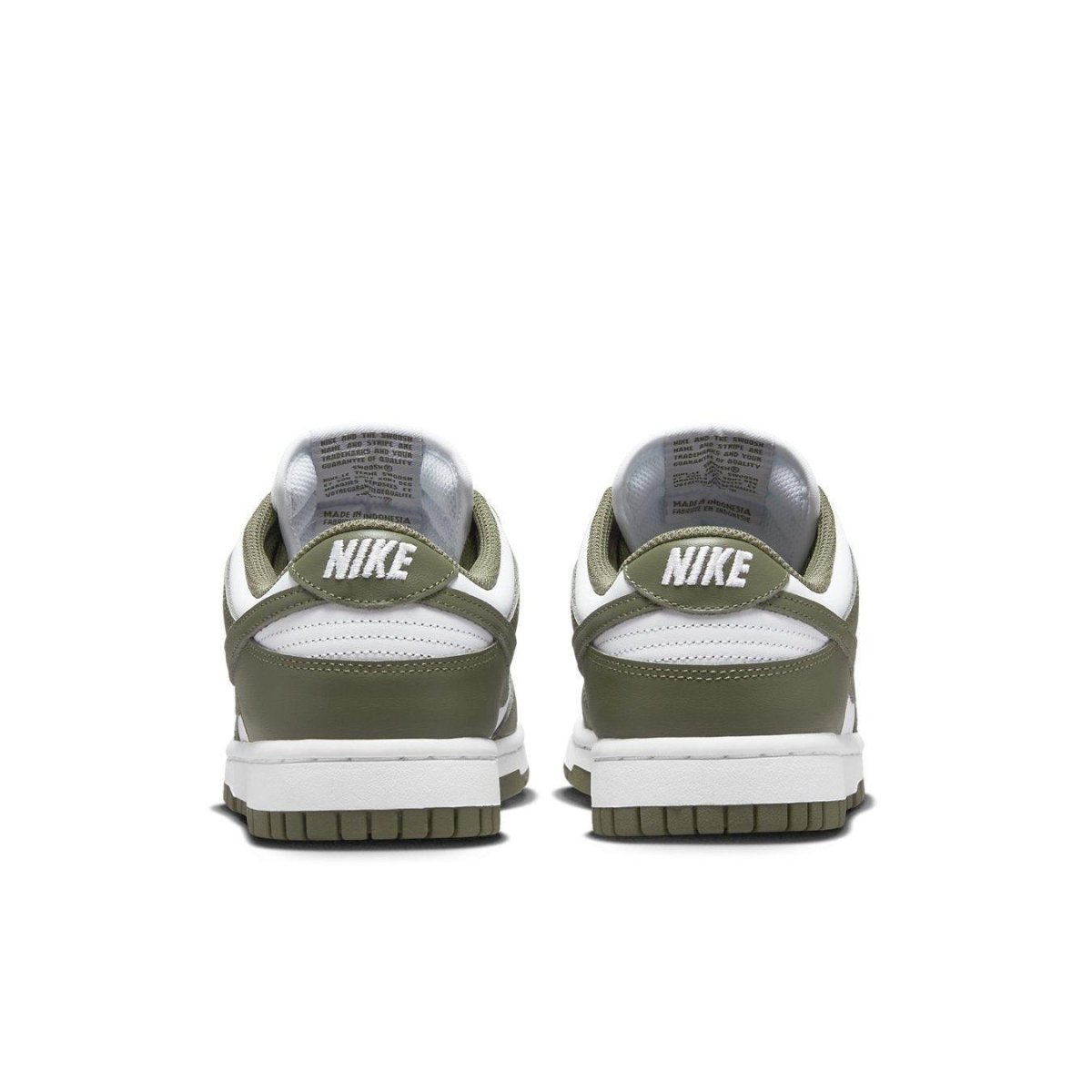 Nike Dunk Low Medium Olive (W) sneakers with white and olive panels, featuring the Nike logo on the heels.