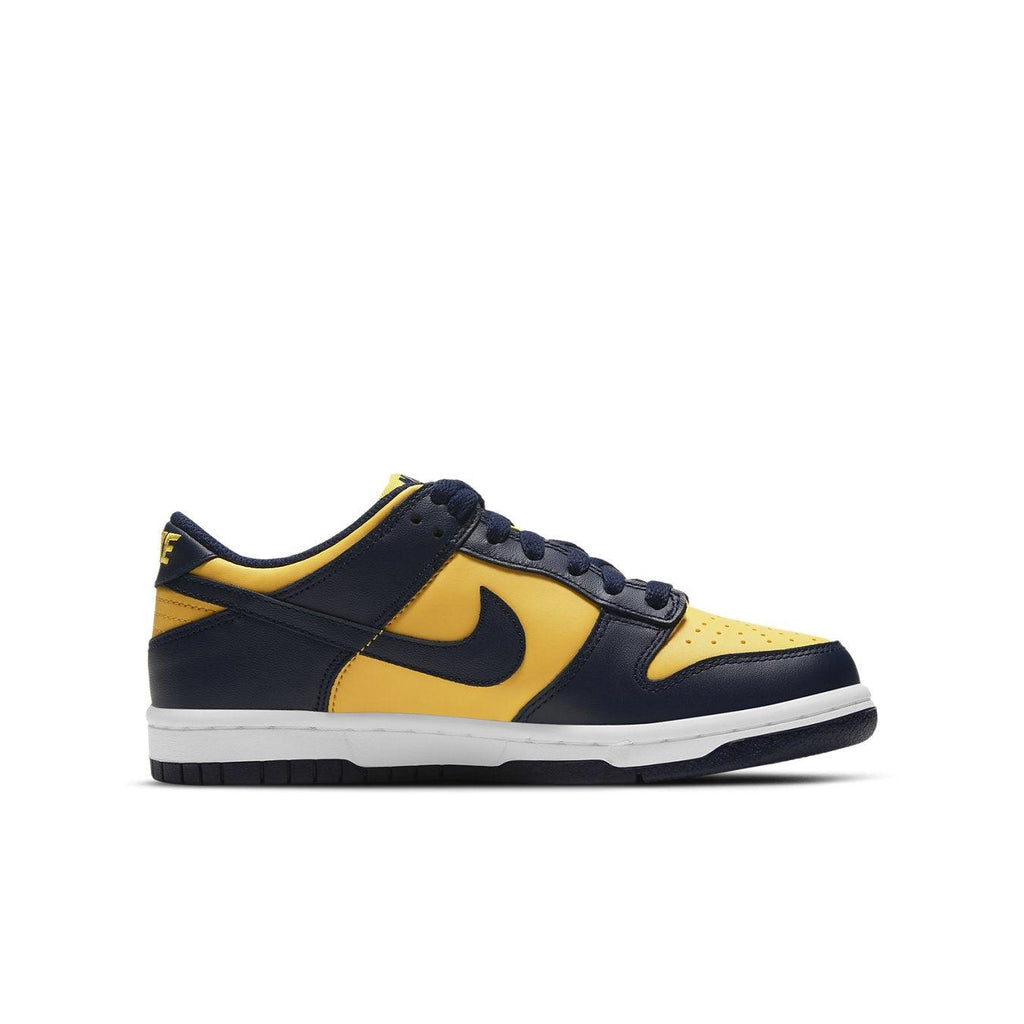 Nike Dunk Low Michigan GS sneaker in vibrant yellow and navy blue, showcasing the classic 'Be True To Your School' design.