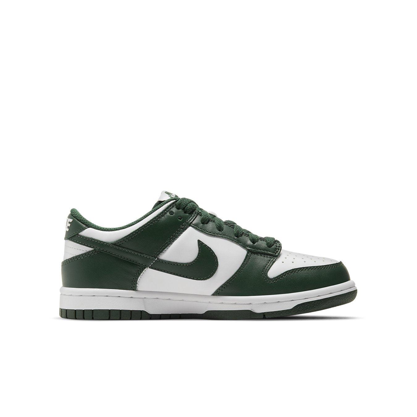 Nike Dunk Low GS 'Michigan State' in white and green, featuring a leather design and low-top silhouette.