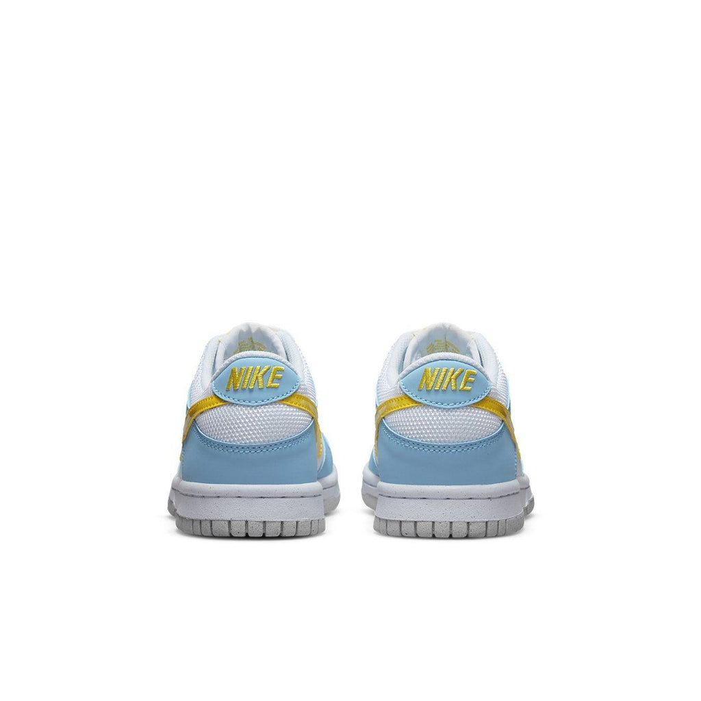 Nike Dunk Low Next Nature Homer Simpson sneakers featuring white, sky blue, and yellow design from the back perspective.
