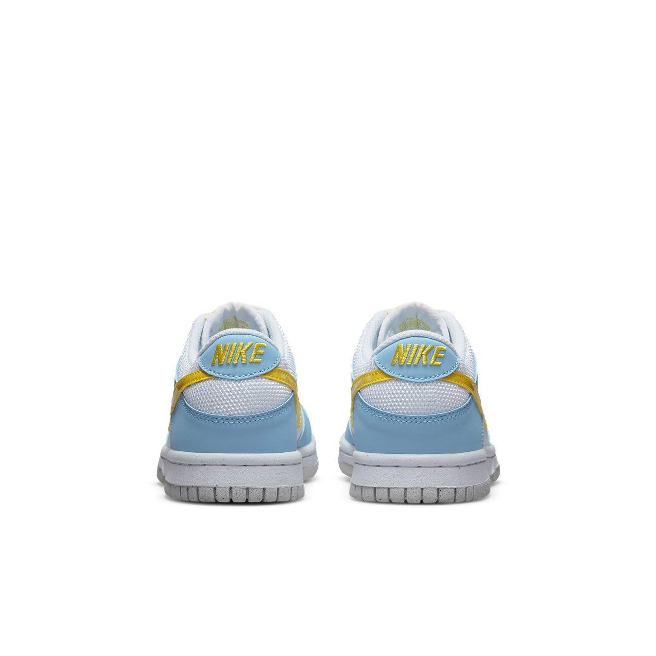 Nike Dunk Low Next Nature Homer Simpson sneakers featuring white, sky blue, and yellow design from the back perspective.