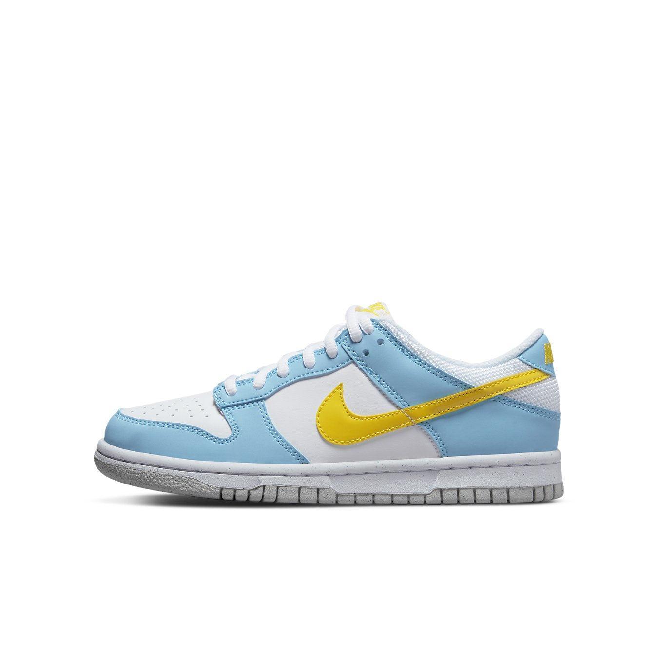 Nike Dunk Low Next Nature Homer Simpson in white, sky blue, and yellow, showcasing a vibrant design.