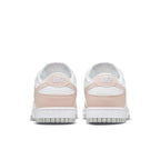 Nike Dunk Low Next Nature Pale Coral women's sneaker rear view with pink accents and white base.