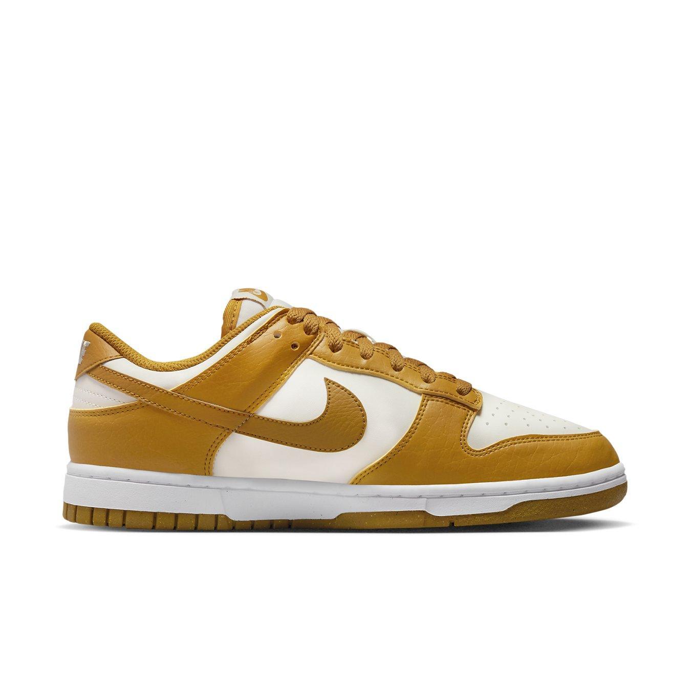 Nike Dunk Low Next Nature Phantom (W) in white and amber colorway, featuring eco-friendly materials and classic design.