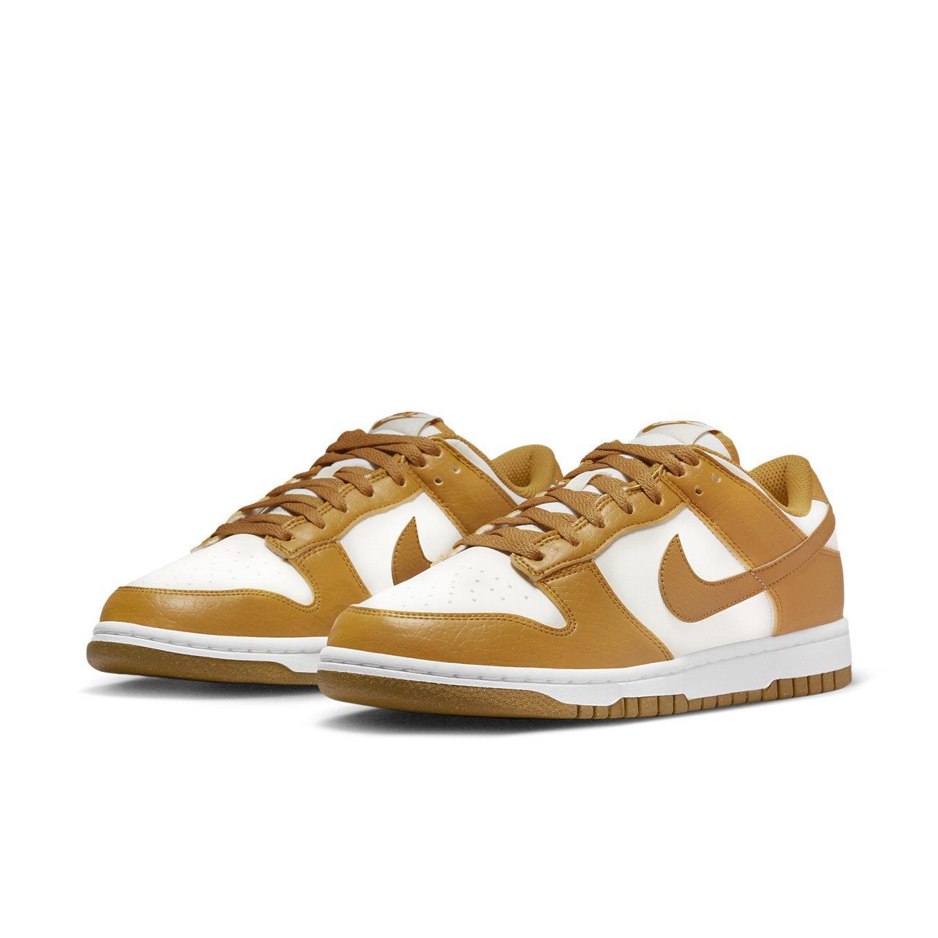 Nike Dunk Low Next Nature Phantom women’s sneakers, featuring eco-friendly materials and a white and amber colorway.